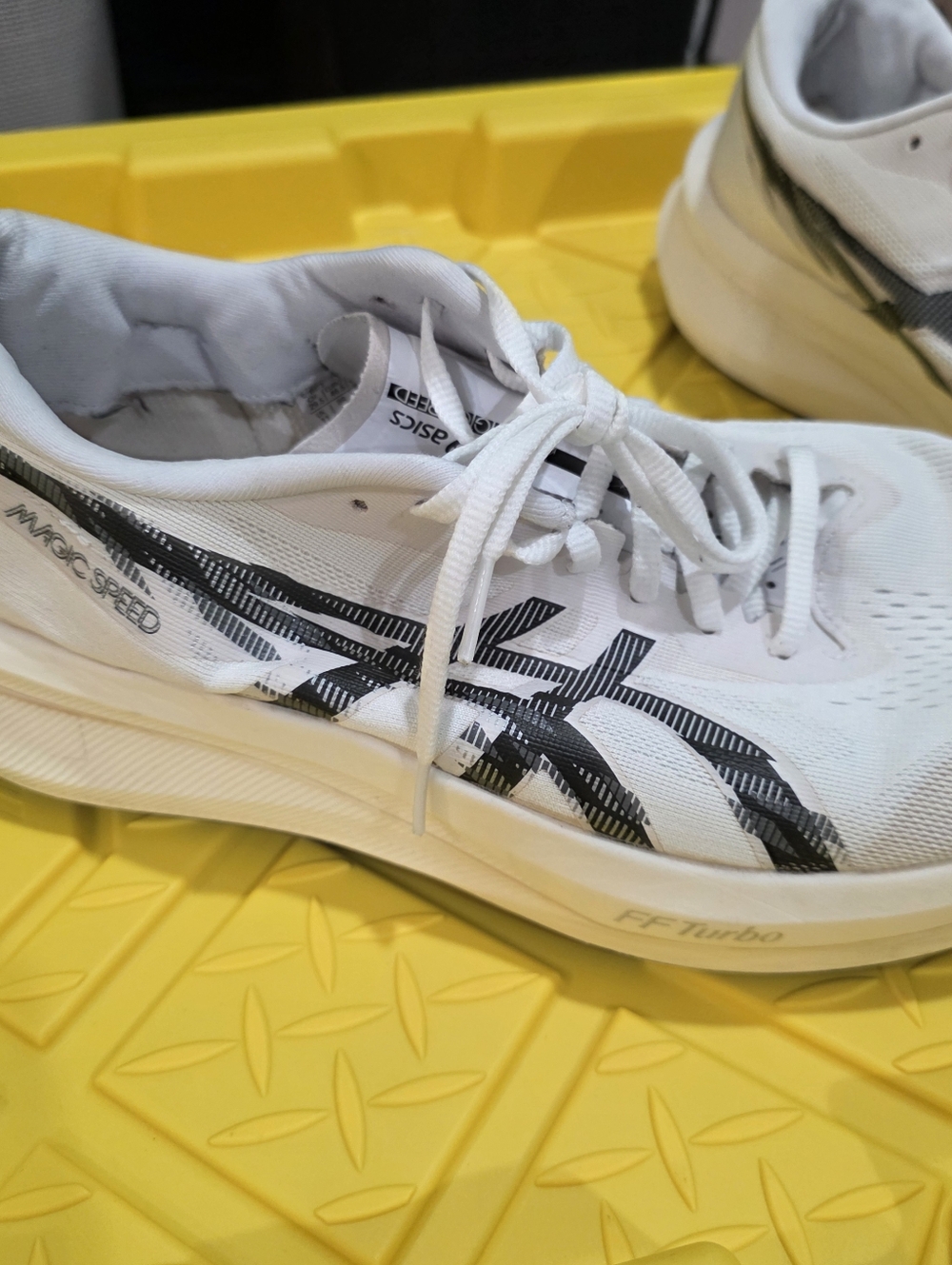 Asics White Running Shoes with Black Accent Stripes
